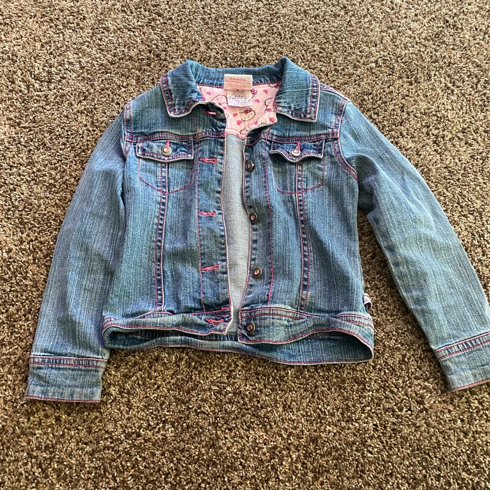 Denim jacket with hello kitty gem design
